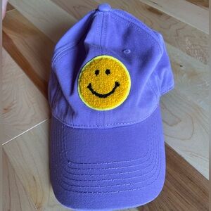 Purple baseball cap smiley happy face
